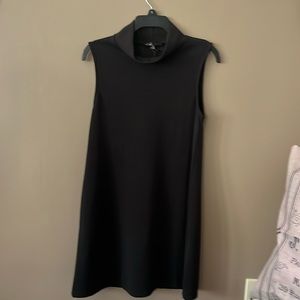 C. Luce Perfect LBD. Great Addition to Any Wardrobe. Sleeveless. Stand-Up Collar